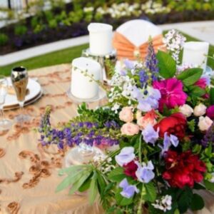 A table with flowers and candles on it