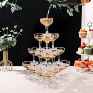 A tower of champagne glasses on top of the table.