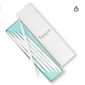 A box of white nail files and a blue bag