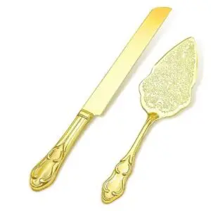 A gold cake server and knife set.