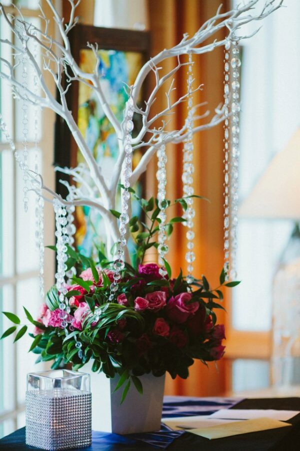 A white tree with pink flowers in it