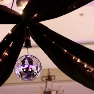 A mirror ball with people inside of it