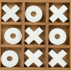 A tic tac toe game with white pieces in it.