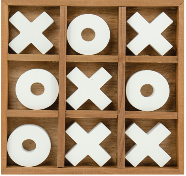 A tic tac toe game with white pieces in it.