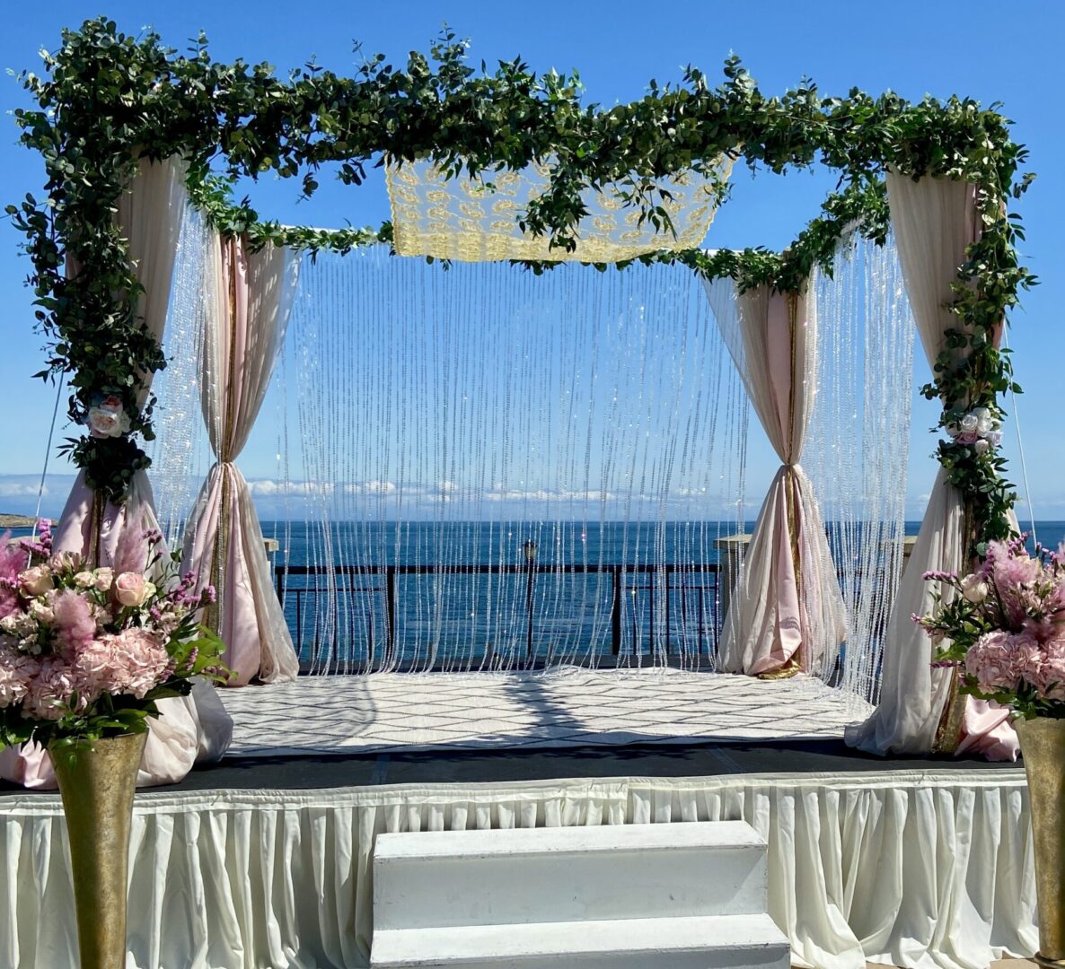 A wedding ceremony with a view of the ocean.