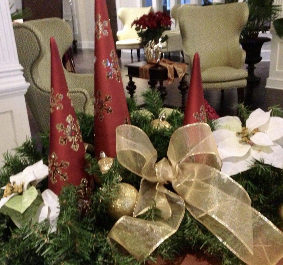 A table with christmas decorations and candles.