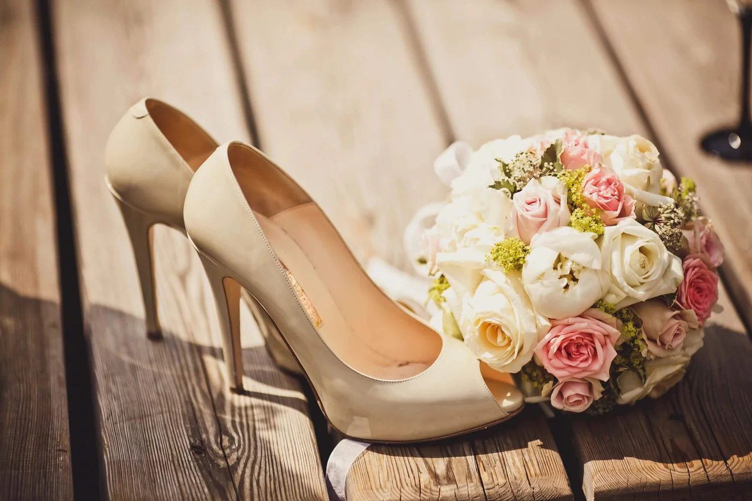 A close up of a pair of shoes with flowers