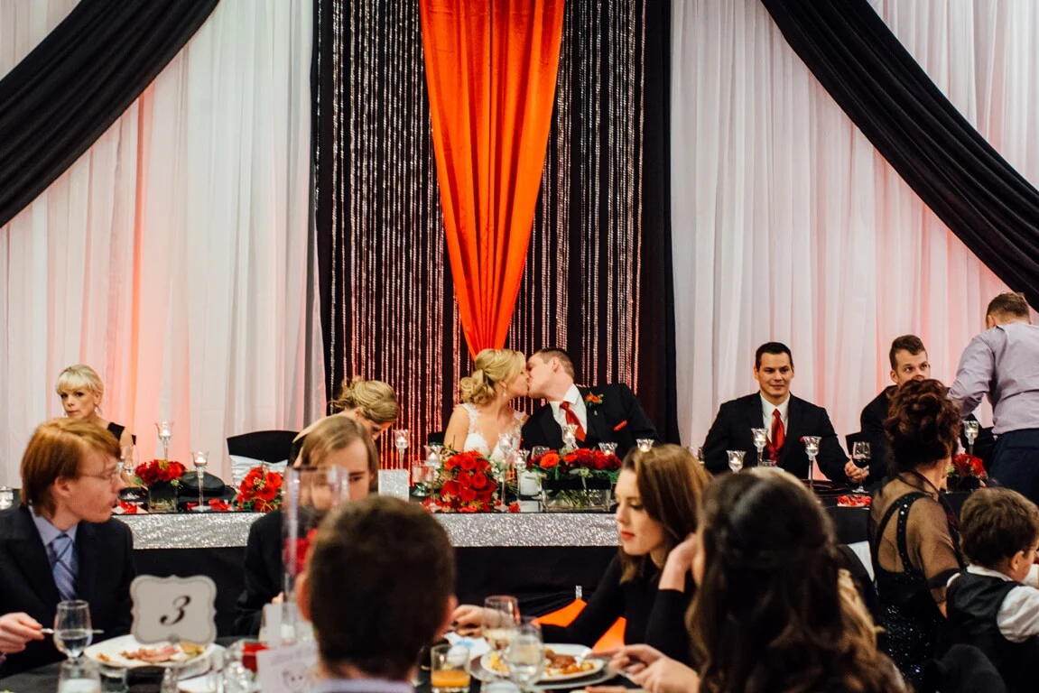 A group of people sitting at tables with food.