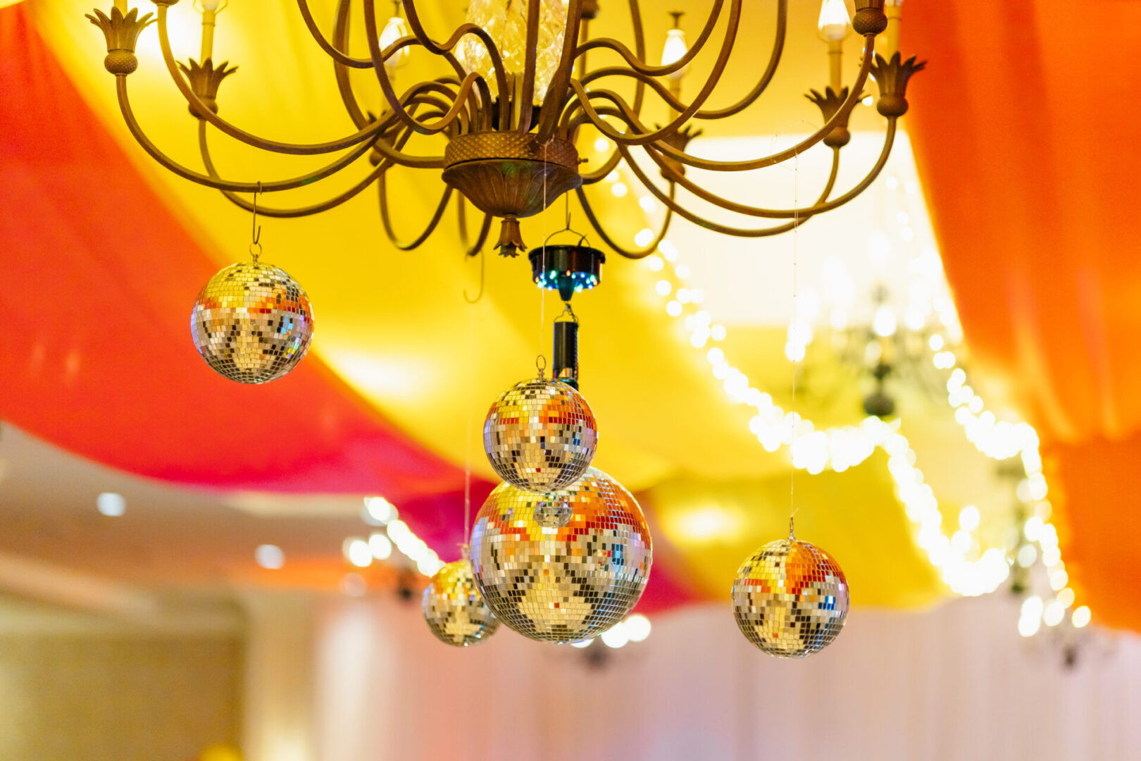 A chandelier with several glass balls hanging from it.