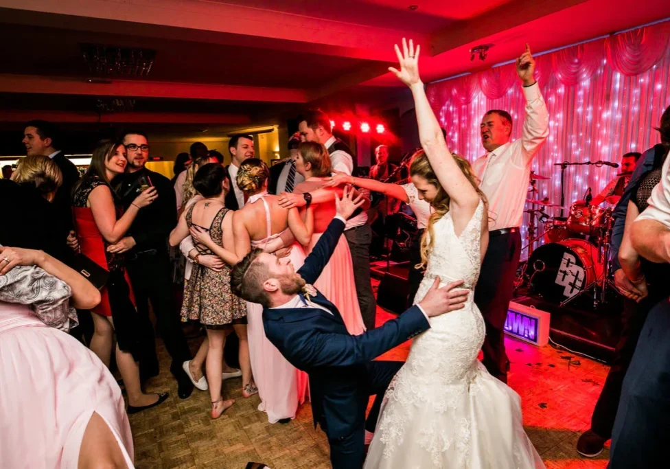 A bride and groom dancing at their wedding.